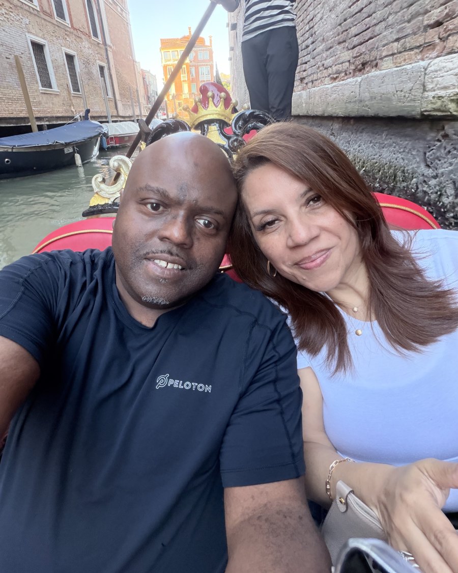 Alex and his wife Marlene smiling together on a gondola ride.